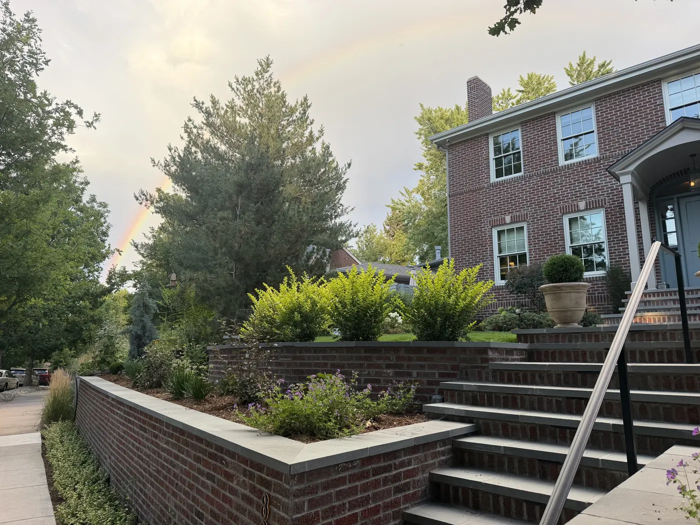 Planted terraces along a front walk
